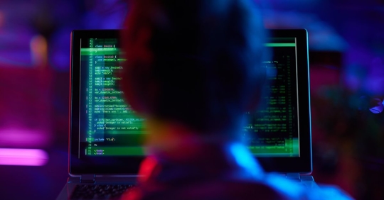 man staring at a computer